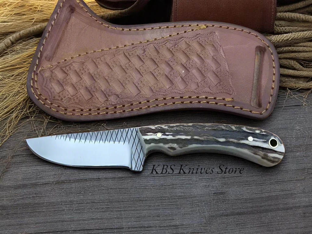 Handmade Lone Rider knife featuring full tang Rasp Tool Steel blade and antler handle