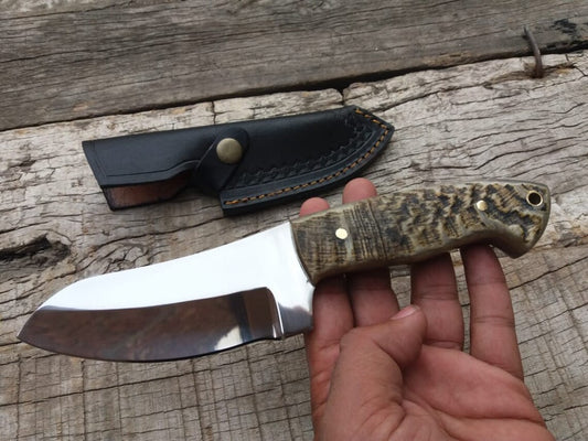 Custom D2 steel hunting knife with mountain sheep horn handle and leather sheath