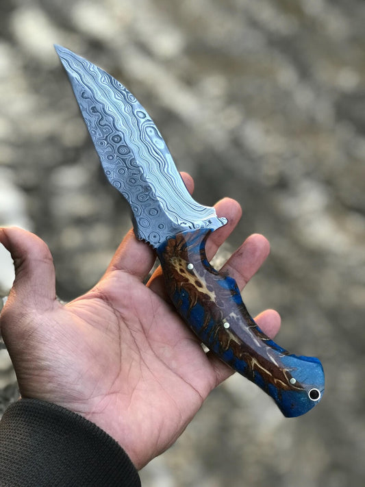 Custom Damascus steel hunting knife with raindrop blade and resin handle