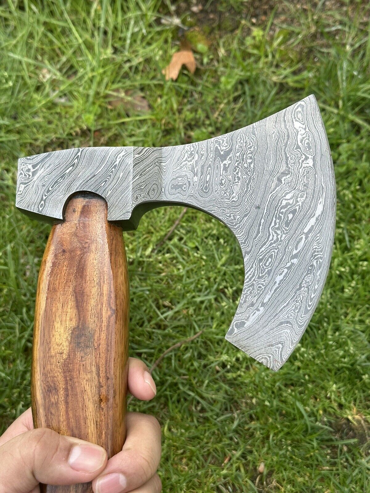 Close-up of Damascus Steel Blade on tomahawak aXe