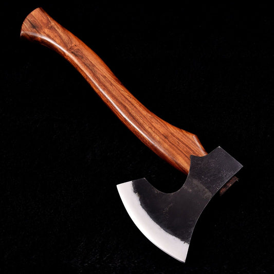 Viking Hatchet with forged 1095 steel blade and rosewood handle on a wooden background
