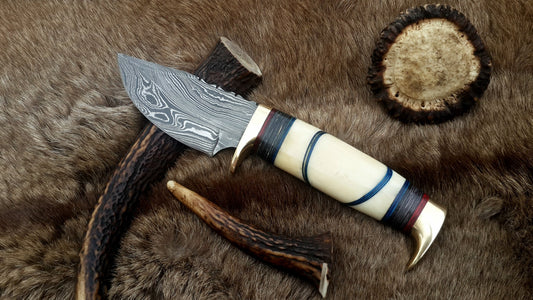 Custom handmade Damascus steel hunting knife with camel bone handle and brass accents