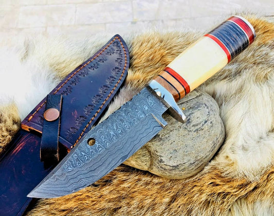 "Big hunting knife with Damascus steel blade and leather sheath."