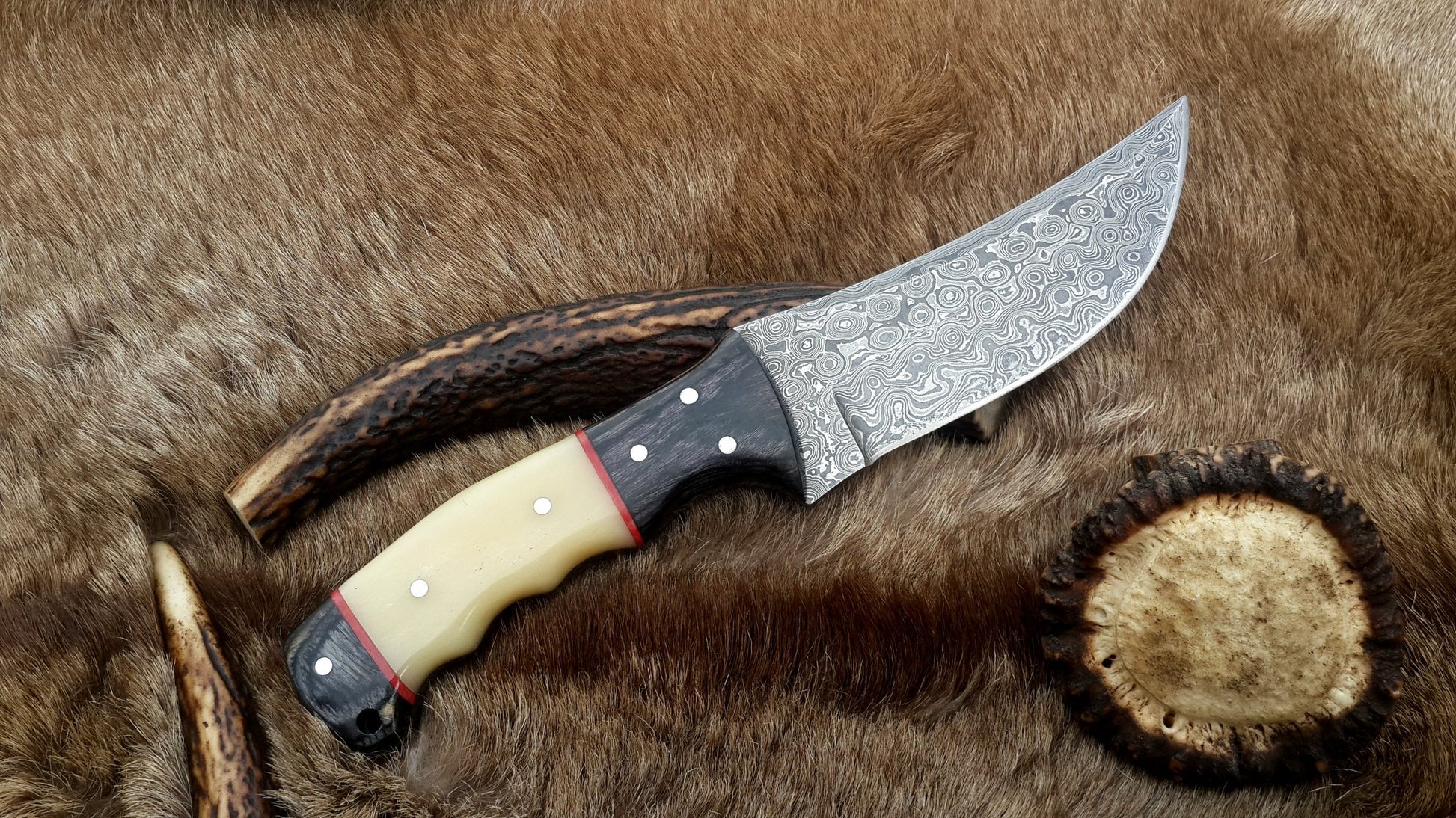 Custom handmade Damascus steel fixed-blade hunting knife with camel bone handle