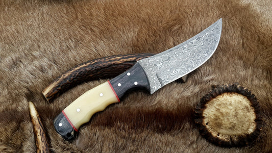Custom handmade Damascus steel fixed-blade hunting knife with camel bone handle