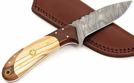 Custom handmade small hunting knife with Damascus steel blade.