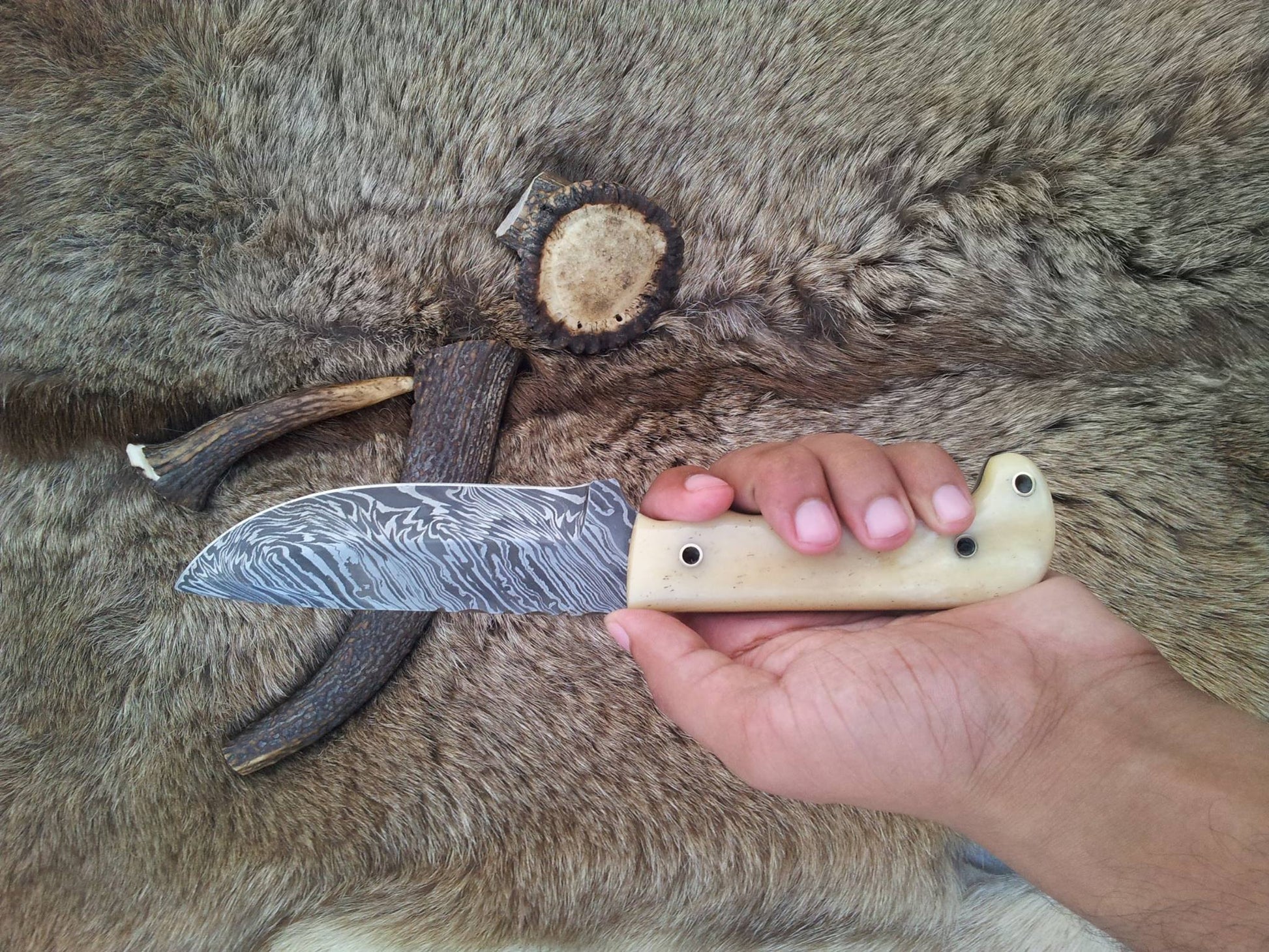 Outdoor hunting knife with durable bone handle for secure grip