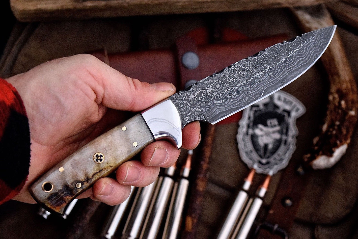 "Handcrafted deer hunting knife with Damascus steel blade."