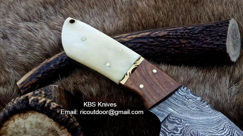 Custom handmade lamb skinner knife with a Damascus steel blade and bone & rosewood handle.