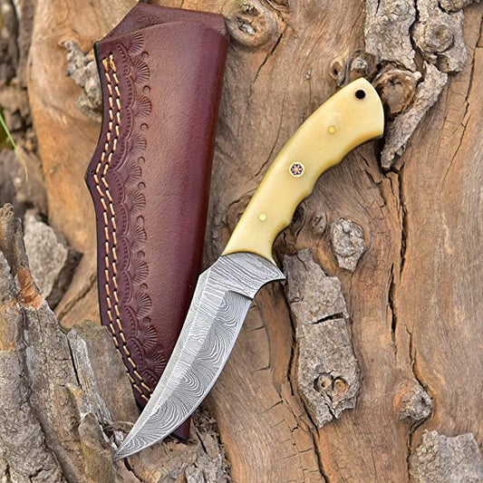Good skinning knife with full tang Damascus steel blade and bone handle.