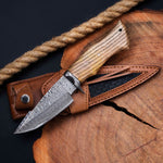 The Wilderness Elegance - A 10-inch hunting knife featuring Damascus Steel Blades, Walnut Wood handle, and Damascus Guard, complete with a leather sheath, available at KBS Knives Store for outdoor enthusiasts and hunters.