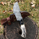Custom handmade tracker knife with Damascus steel blade and antler horn handle
