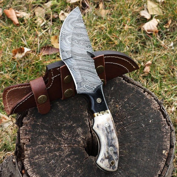 Custom handmade tracker knife with Damascus steel blade and antler horn handle
