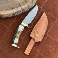 Custom Damascus steel hunting knife with antler horn handle
