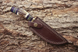 Custom hunting knife with antler horn, exotic wood, and brass guard handle
