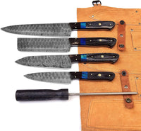 Collection of kitchen knives including chef knife and cleaver