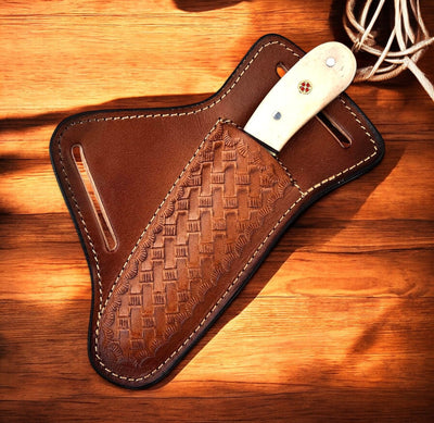 Full view of the 7-inch Bull Cutter knife with horizontal leather sheath.