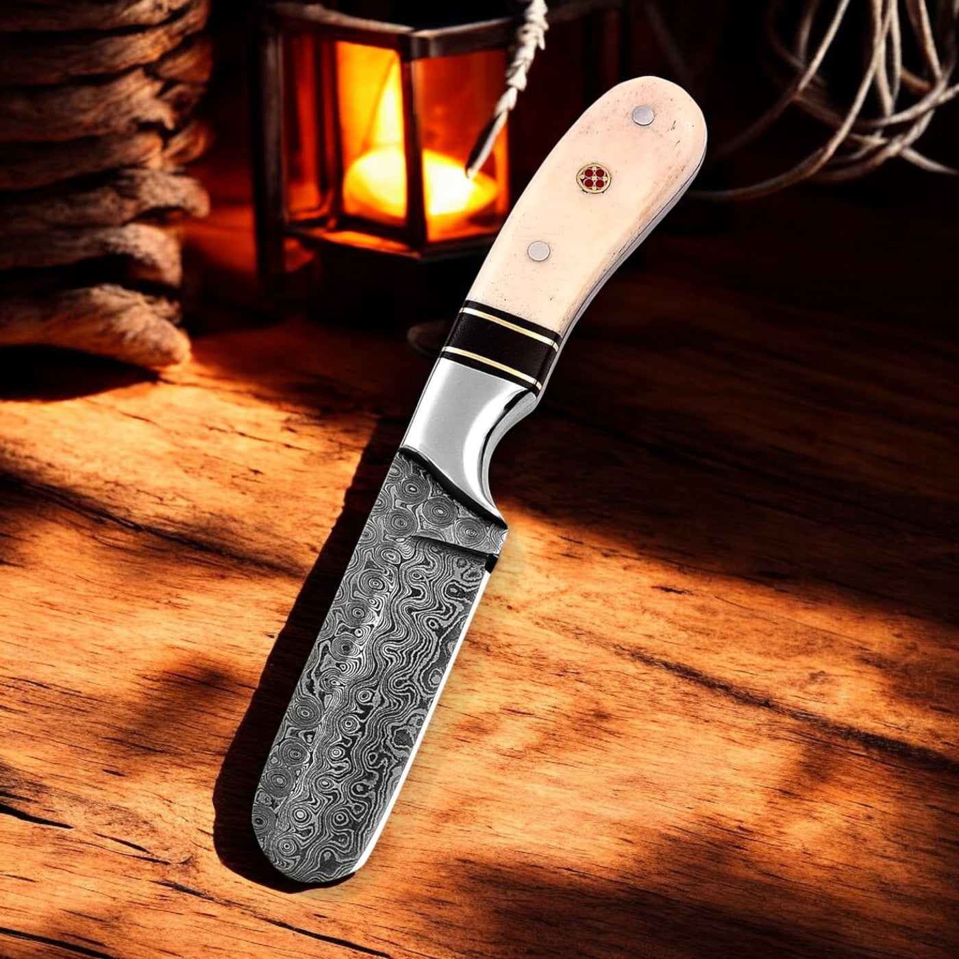 Bull Cutter knife showcasing the Raindrops Damascus steel blade.