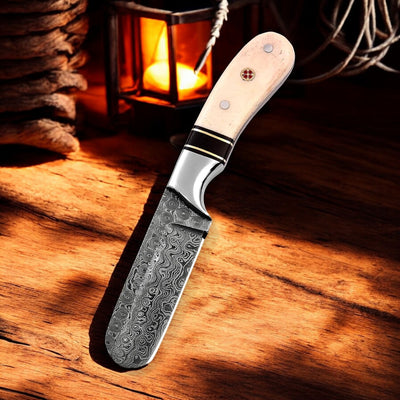 Bull Cutter knife showcasing the Raindrops Damascus steel blade.