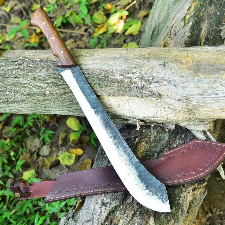 Custom handmade high carbon steel camping knife with leather sheath.
