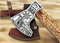 Close-up of the etched metal engraving on the 1095 steel blade of the Norse axe
