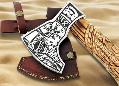 Close-up of the etched metal engraving on the 1095 steel blade of the Norse axe
