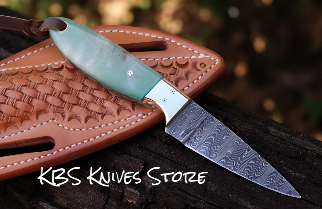 Custom 3 inch Damascus cowboy sheath knife with antique sheep horn handle and brass bolster