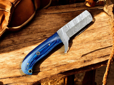 Damascus bull cutter knife in ranch cutting demonstration showing blade performance