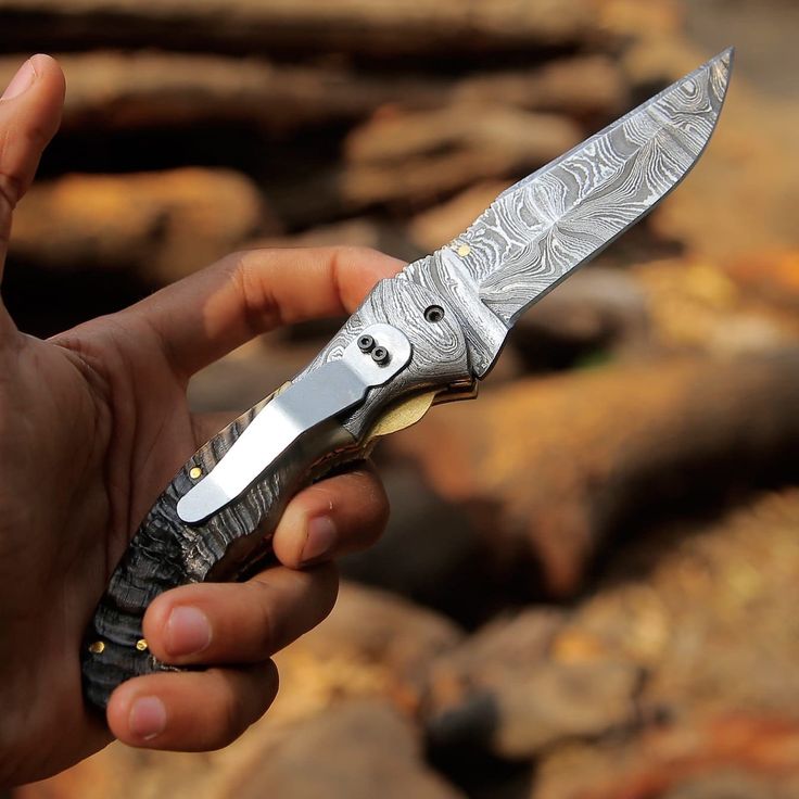 Damascus steel bolster of the Mountain Majesty folding pocket knife