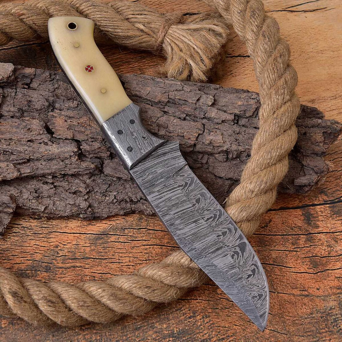 Damascus steel bolster of the Whitetail Warrior deer hunting knife