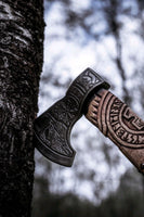 Handcrafted battle axe with roll-wrap leather grip and detailed blade engravings
