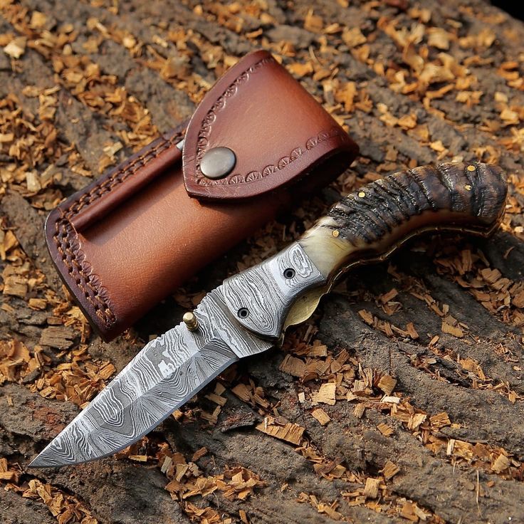 Mountain Majesty folding pocket knife with KBS Knives logo engraved on the blade and leather case
