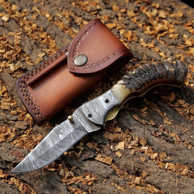 Mountain Majesty folding pocket knife with KBS Knives logo engraved on the blade and leather case