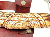 Norse axe with leather-wrapped ash wood handle and included protective leather sheath
