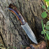 Rosewood handle of the Wilderness Warrior hunting knifek