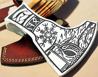 Side view of the Norse axe showing the detailed hand engraving on the handle and blade

