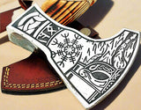 Side view of the Norse axe showing the detailed hand engraving on the handle and blade
