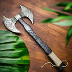 Side view of the Viking axe showing both sharp edges and engraved axe head
