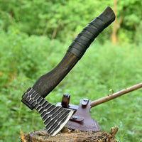 Viking battle axe with leather-wrapped ash wood handle and leather sheath
