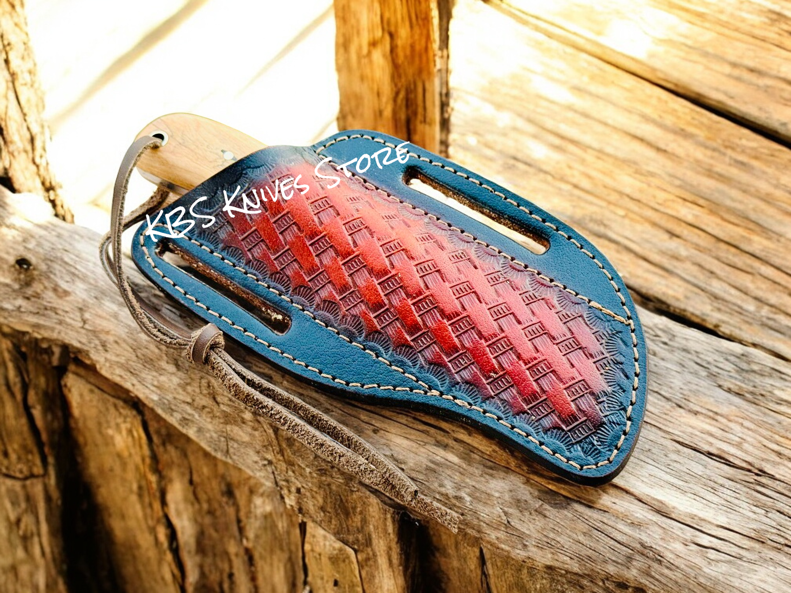 Leather sheath with red and blue gradient on a wooden surface