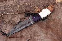 Custom Damascus steel hunting knife with G10, bone, and rosewood handle
