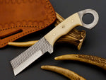 Cowboy castrator knife displayed with a handcrafted leather sheath.
