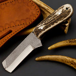 Custom castrating knife in sheath, ready for use on the ranch.
