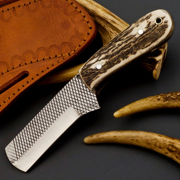 Custom castrating knife in sheath, ready for use on the ranch.
