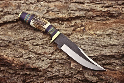 Handmade hunting knife with brass guard and leather sheath

