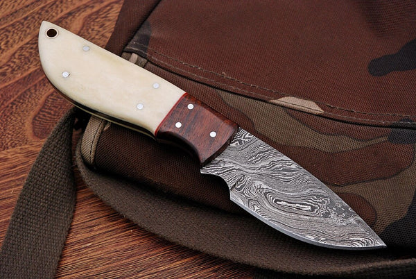 Good skinning knife with 8-inch Damascus blade, ideal for deer skinning and general use.

