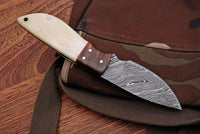 Great skinning knife with custom Damascus steel blade and rosewood and bone handle, Rockwell Hardness 55-58 HRC.
