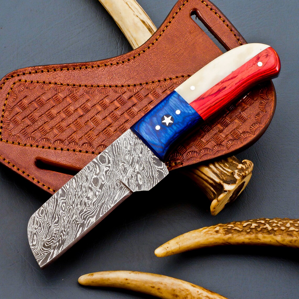 Custom handmade castration knife sheathed, ready for farm use.
