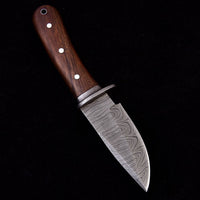 Great skinning knife for deer with walnut wood handle, Damascus guard, and leather sheath.
