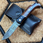 Damascus steel folding pocket knife with rosewood handle, perfect for everyday use and collection.